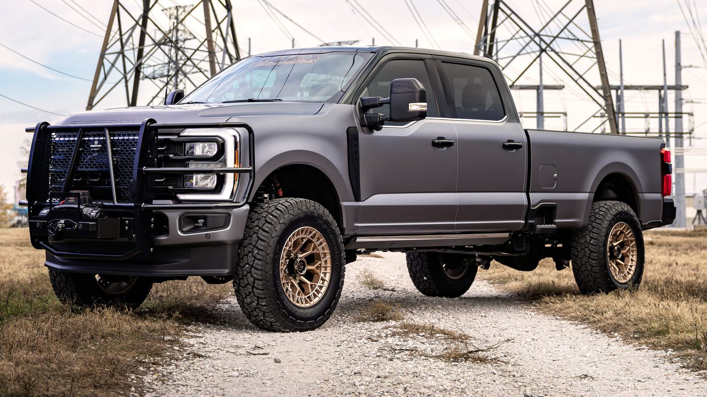 Lifted Ford F-350 on bronze wheels built by Apex Custom Innovations
