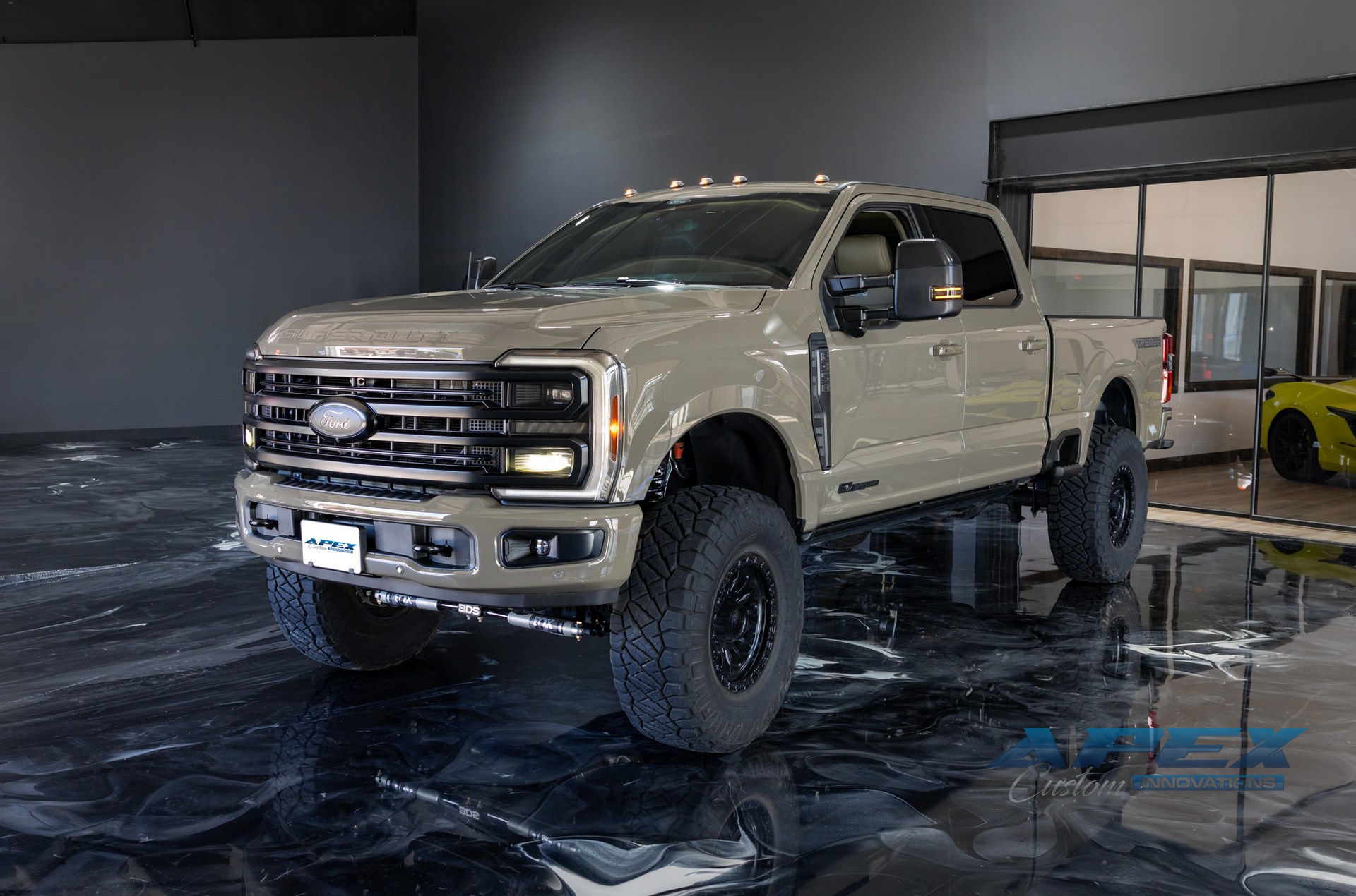 Custom Ford Super Duty truck featuring lifted suspension, off-road wheels and tires, and aftermarket accessories installed by Apex Custom Innovations