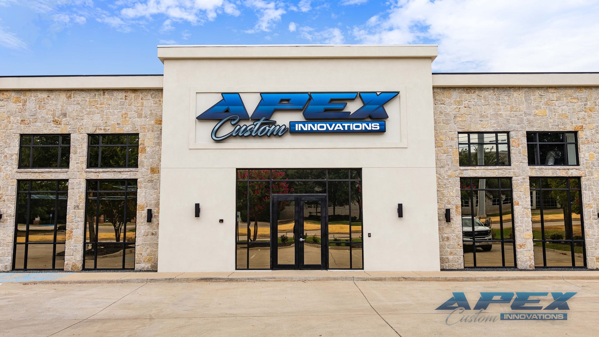 Apex Custom Innovations storefront in Carrollton, Texas, with the Apex sign over the entrance