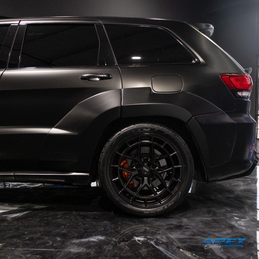 2018 Jeep Grand Cherokee Trackhawk with Vossen HFX-1 wheels, Nitto tires, matte black wrap, and Waido widebody kit built by Apex Custom Innovations in Dallas Texas