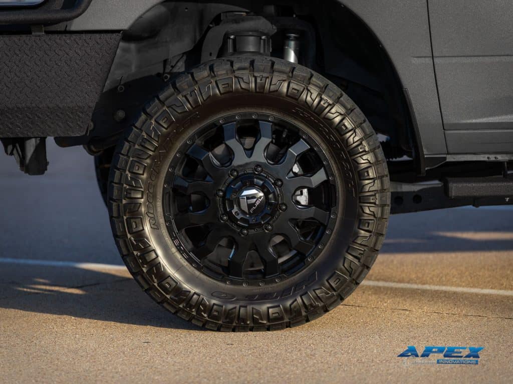 Close-up of Fuel Off-Road wheel and Nitto Ridge Grappler tire on 2022 Ram 3500 flatbed build