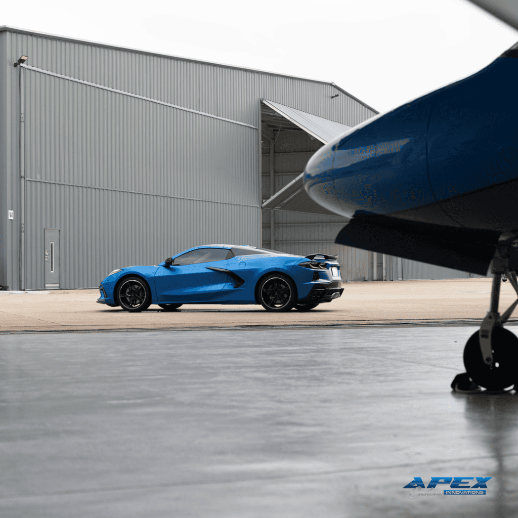 2024 Chevrolet Corvette Stingray with Apex Armor paint protection film installed by Apex Custom Innovations inside aircraft hangar