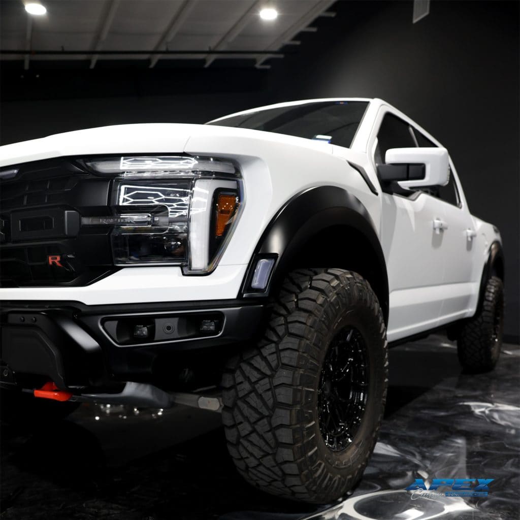 2025 Ford F-150 Raptor R with Vossen HFX1 wheels and Nitto Ridge Grappler tires photographed in the Apex Custom Innovations studio in Dallas Texas