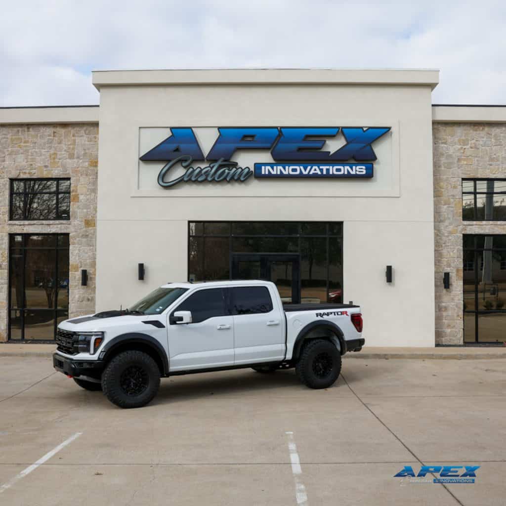 2025 Ford F-150 Raptor R with Vossen HFX1 wheels and Nitto Ridge Grappler tires photographed in the Apex Custom Innovations studio in Dallas Texas