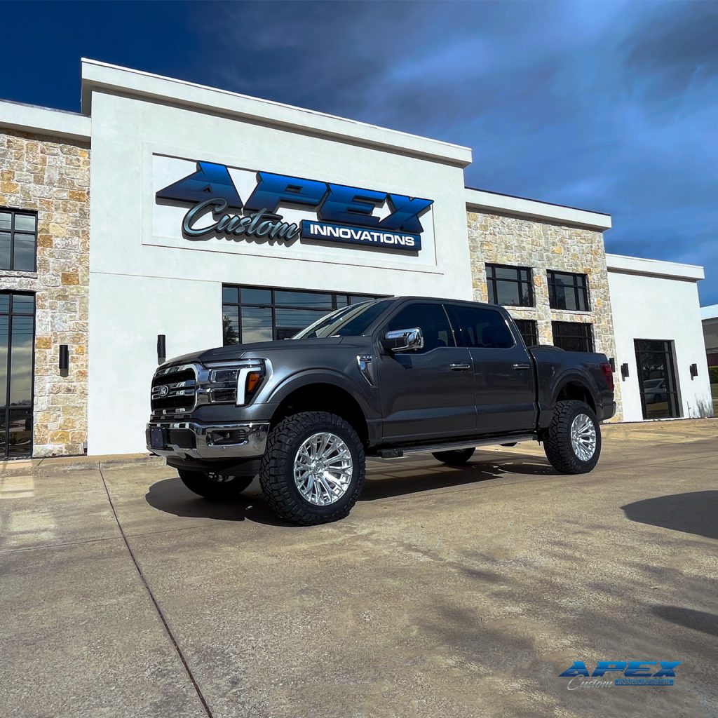 Front angle of a 2025 Ford F-150 Lariat with ReadyLIFT 3.5-inch lift, Fuel 20-inch wheels, and Nitto Ridge Grappler tires built by Apex Custom Innovations in Dallas Texas
