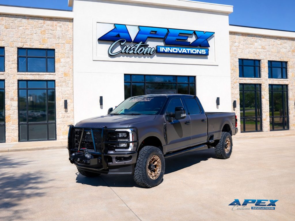 2025 Ford F-350 King Ranch custom build parked in front of Apex Custom Innovations in Dallas, Texas