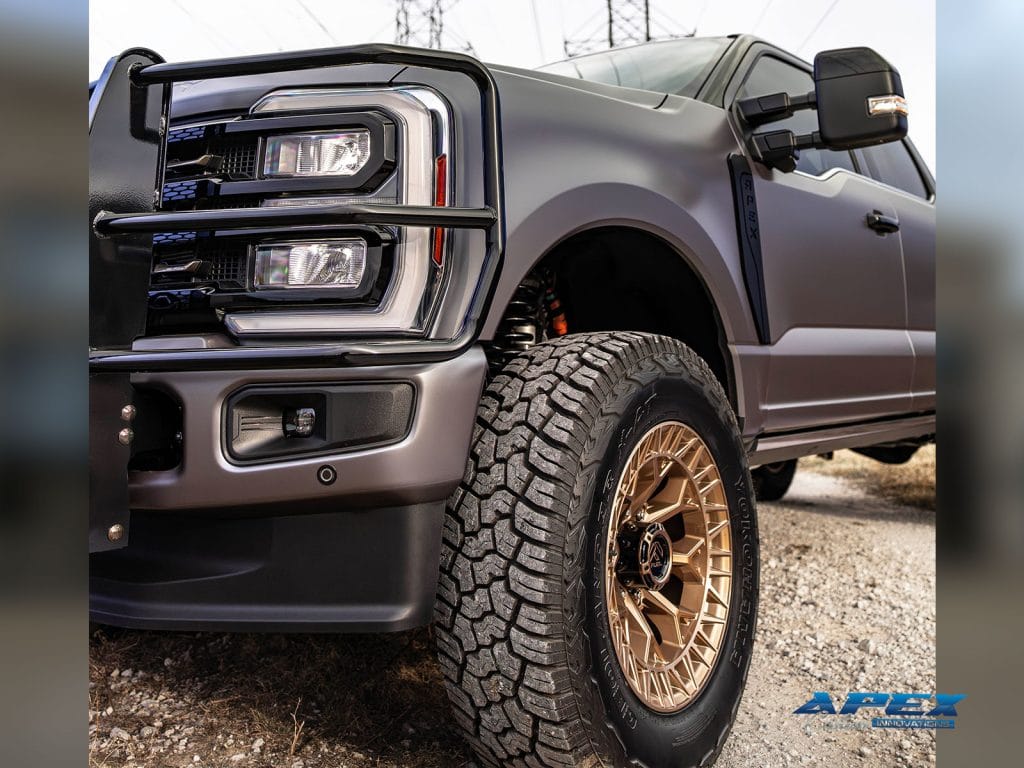 Front suspension and wheel detail of lifted 2025 Ford F-350 King Ranch with Fuel Off-Road wheels and Yokohama Geolandar X-AT tires