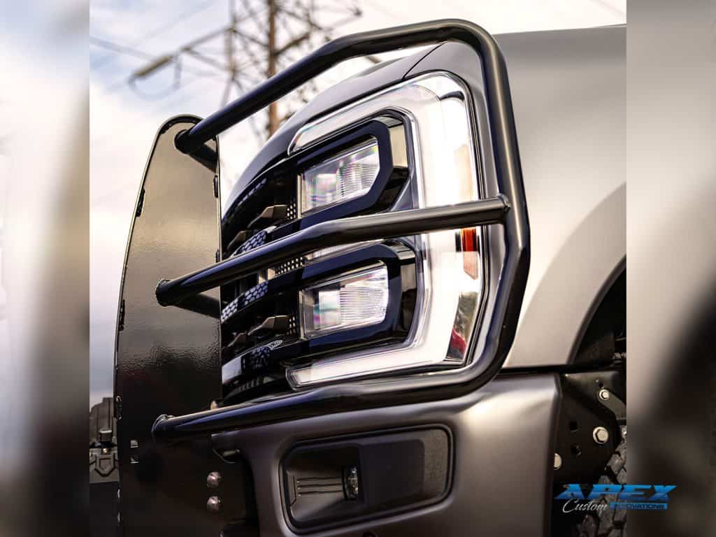 Close-up of Ranch Hand brush guard and headlight protection on a 2025 Ford F-350 custom build by Apex Custom Innovations