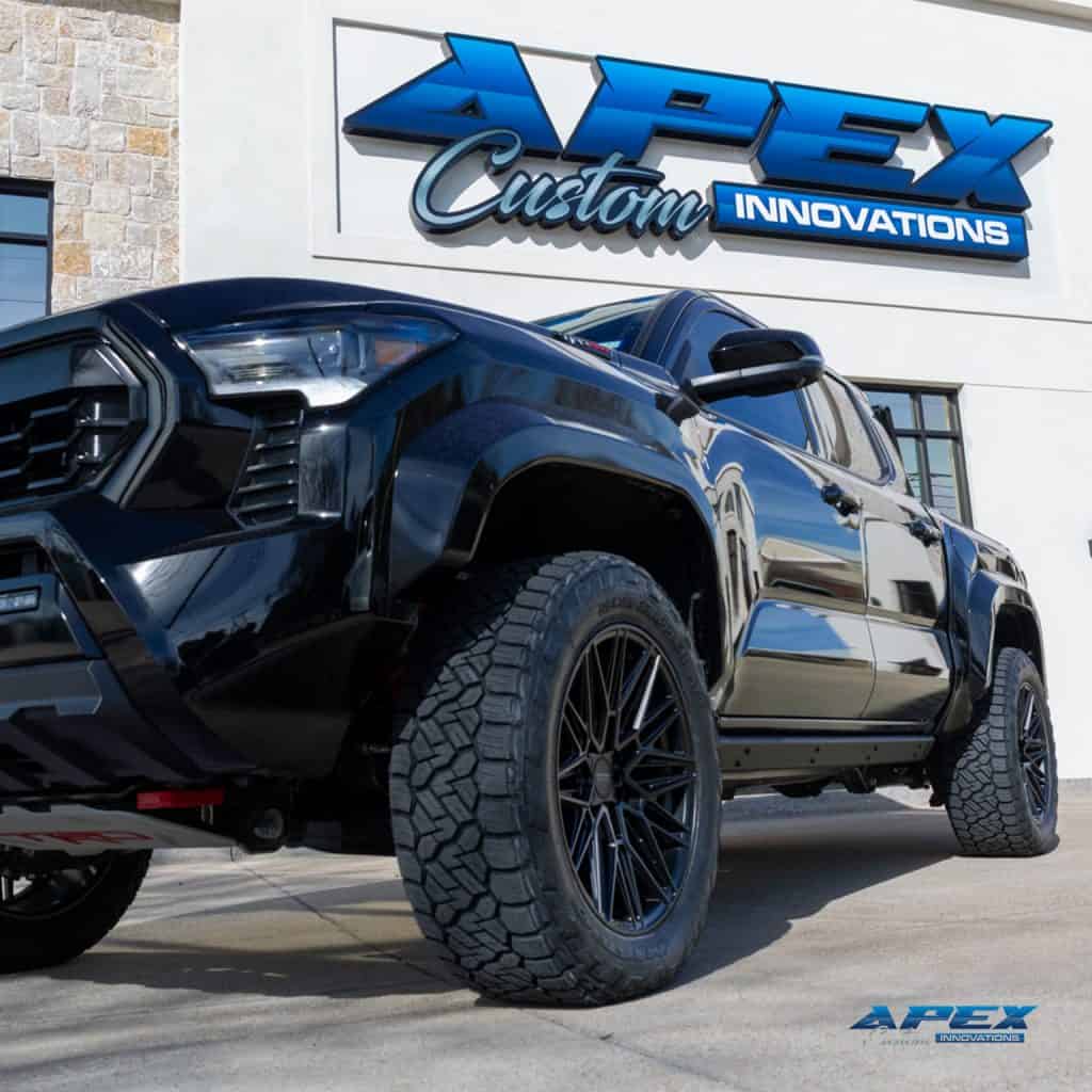 Low front angle of 2025 Toyota Tacoma TRD Pro with Vossen HF-7 20-inch wheels and Nitto Recon Grappler tires installed by Apex Custom Innovations in Carrollton, Texas