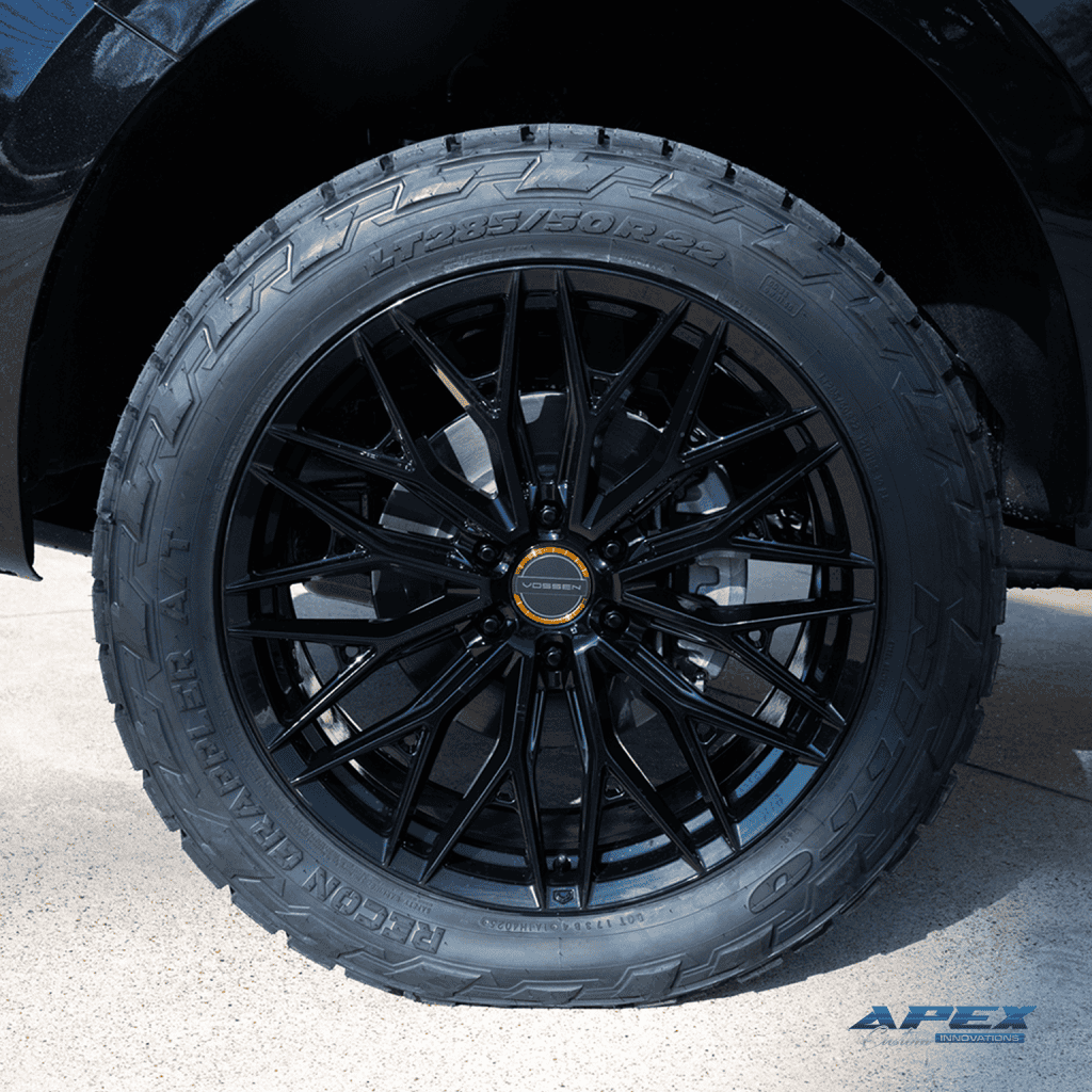 Close up wheel of a 2026 Ford Expedition Tremor with ReadyLIFT 3-inch lift, Vossen HFX-6 wheels, and Nitto Ridge Grappler tires built by Apex Custom Innovations in Dallas Texas