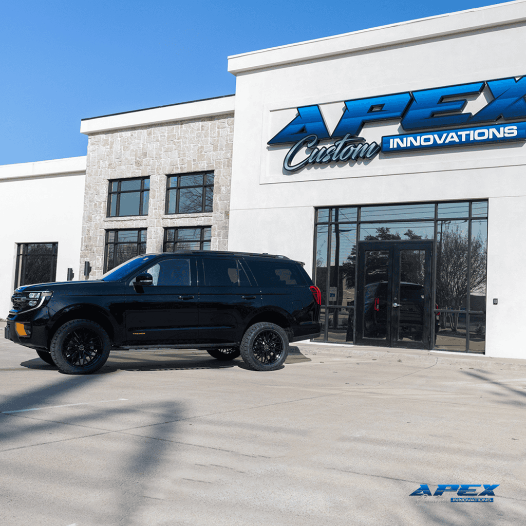 Hero shot of a 2026 Ford Expedition Tremor with ReadyLIFT 3-inch lift, Vossen HFX-6 wheels, and Nitto Ridge Grappler tires built by Apex Custom Innovations in Dallas Texas