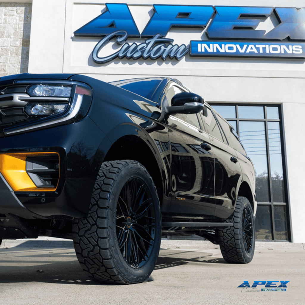 Low front of a 2026 Ford Expedition Tremor with ReadyLIFT 3-inch lift, Vossen HFX-6 wheels, and Nitto Ridge Grappler tires built by Apex Custom Innovations in Dallas Texas