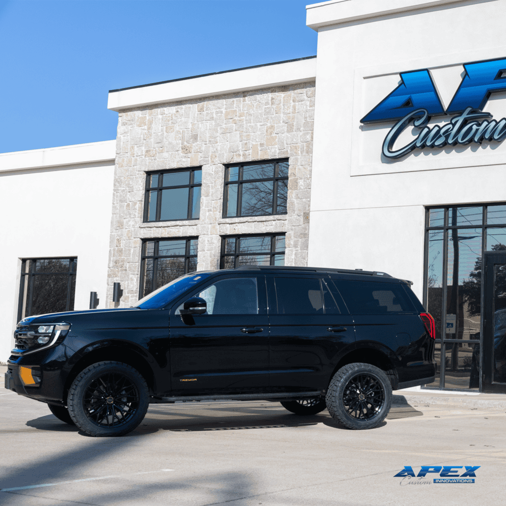 Side profile of a 2026 Ford Expedition Tremor with ReadyLIFT 3-inch lift, Vossen HFX-6 wheels, and Nitto Ridge Grappler tires built by Apex Custom Innovations in Dallas Texas